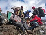 10 4 Tashi Negotiating With Yak Herders When the yak herders arrived, we just sat there for half an hour not moving at all. The Tibetans wanted to make camp right where we were, while the rest of us wanted to move farther. The warm feeling of the night before vanished as we insisted to keep trekking. Tashi implored the Tibetans to move, and after another ten minutes of haggling they agreed.